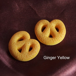 Set of two ginger yellow resin pretzel charms for DIY phone case making and crafts