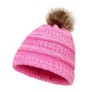 Close-up of pink knit hat texture and fluffy brown pom-pom with detailed winter stitching