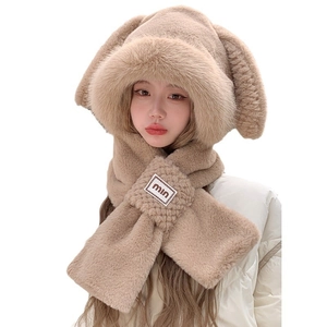 Detail view of plush rabbit ear hooded scarf with soft faux fur texture and logo patch