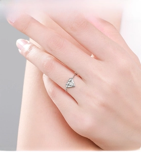 Macro shot of S925 sterling silver chain ring featuring a geometric diamond-set pendant