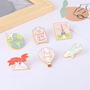 Cartoon travel enamel pin set with airplane, hot air balloon and suitcase designs