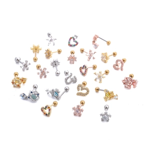 Detail of assorted heart and star zircon stud earrings with screw ball backs