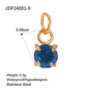 Detail view of a 0.68cm blue zircon pendant with gold-plated stainless steel four-prong setting