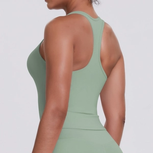 Detail view of sage green racerback sports vest and leggings in high-elastic fabric