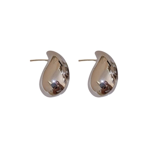 Polished gold metal teardrop earrings with a minimalist drop design for women