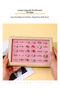 Close-up of walnut wood ring display tray with high-capacity pink velvet slots
