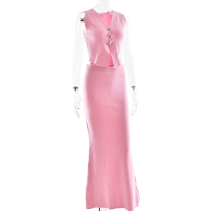 Close-up of pink knitted V-neck sleeveless button vest and slim long skirt set detail