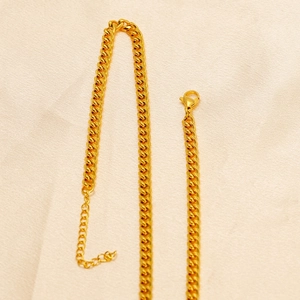 Classic golden braided curb chain necklace with secure lobster clasp and adjustable extension