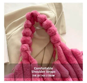 Detail of soft faux fur strap on a vibrant magenta tote bag with fluffy ball textures