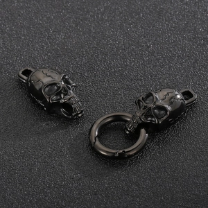 Detailed view of gothic black steel skull jewelry clasp and ring link for punk bracelets