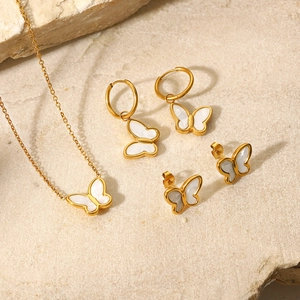 18K gold plated butterfly jewelry set with white shell inlay on textured stone
