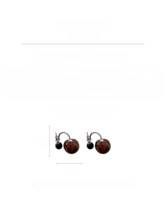Detail of amber leopard print resin hoop earrings with silver pins and 7.3g weight info