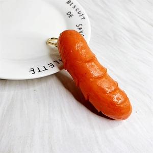Close-up of realistic roasted sausage keychain with detailed texture and golden clasp