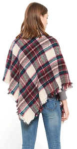 Detailed back view of a red and green plaid shawl with elegant fringed edges for women
