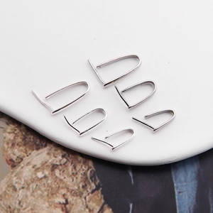 Macro shot of silver S925 sterling silver pinch bails for DIY jewelry pendants