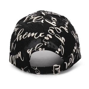 Detail of street style black baseball cap with letter prints and metal back buckle