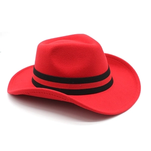 Detail of red wool felt cowboy hat featuring a black and red striped decorative band
