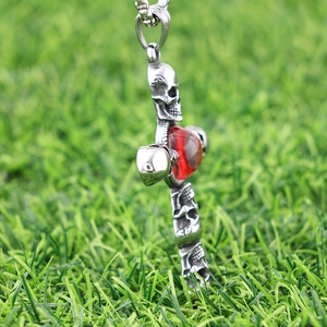 Gothic silver stainless steel cross pendant with red cat eye stone and skull carving details