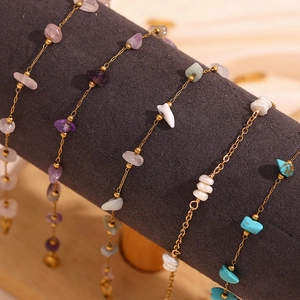 Detail of 18K gold plated stainless steel anklet with colorful natural crushed stones