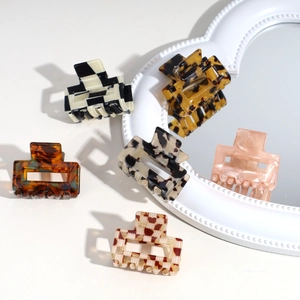 Assorted acetate square hair claws in leopard print and checkerboard patterns for women