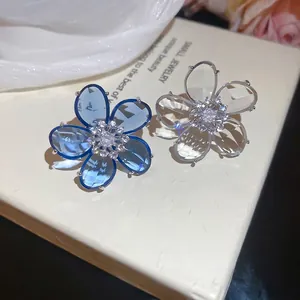 Elegant zircon flower ear clips in navy blue and clear crystal on silver alloy base