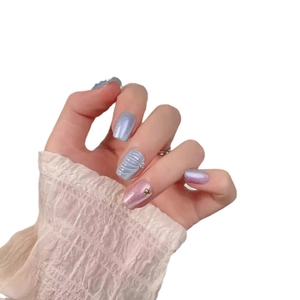 Handmade mermaid shell press-on nails with blue and pink gradient, pearls and gold stars