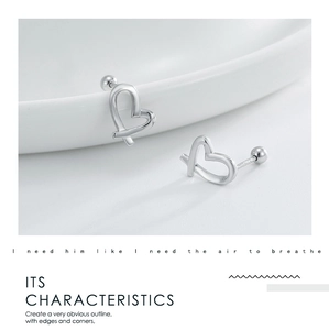Macro detail of irregular S925 sterling silver heart earrings with hallmark