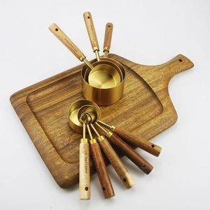 8-piece gold stainless steel measuring cups and spoons set with acacia wood handles