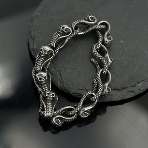 Punk style stainless steel snake chain bracelet with skull cobra heads on dark stone