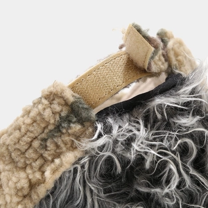 Macro view of plush camo baseball cap with adjustable Velcro strap and fleece texture