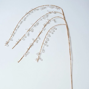 Golden Christmas tree branch with transparent acrylic crystals for festive home decoration