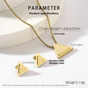 Detailed view of gold stardust triangle necklace and earrings set with measurements