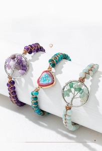 Detailed close-up of handmade woven Tree of Life bracelets with natural gravel stones