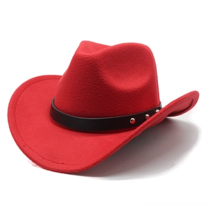 Side view of red felt cowboy hat with black leather band and silver metal studs