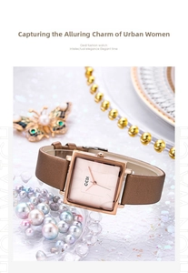 Close-up of a women's vintage square quartz watch with rose gold case and brown leather strap