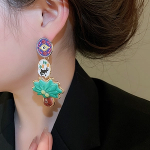Detailed view of colorful enamel geometric heart earrings with unique eye and animal motifs