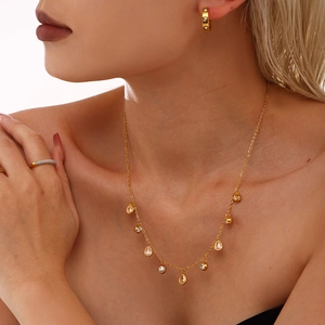 Elegant 18k gold plated teardrop tassel necklace set with iridescent rhinestones