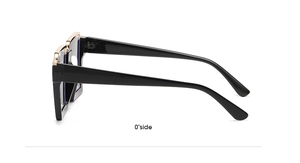 Side view of black square frame glasses with golden hinge details on white background