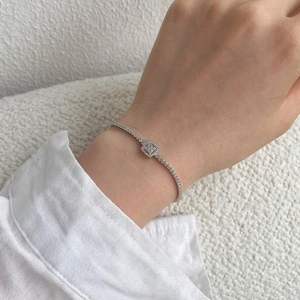 Close-up of S925 silver tennis bracelet with cubic zirconia on a female wrist