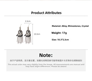 Macro shot of silver tassel earrings with black rhinestones, size 10.3x2.3cm and 17g weight