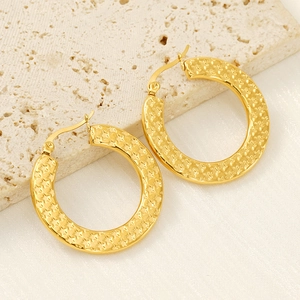 Chic gold stainless steel hoop earrings with star relief pattern on a stone pedestal