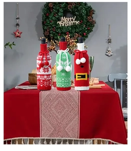 Detailed view of three festive knitted Christmas wine bottle covers on dining table decor