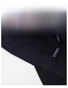 Detail of widened moisture-wicking sweatband and embroidery inside the black sports cap