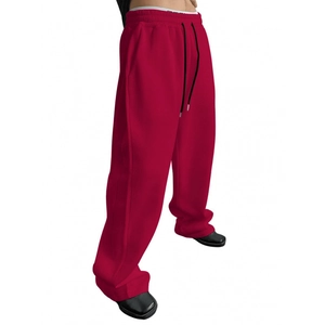 Relaxed fit red jogger pants for men and women with elastic waist in minimalist style