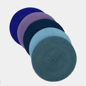Classic wool beret hats for women in multiple colors displayed on a white background