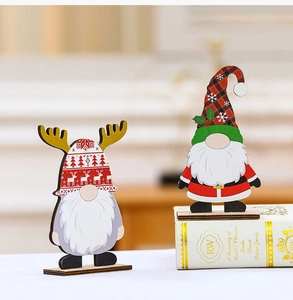 Close-up of wooden Christmas gnome figurines featuring reindeer antlers and plaid hats