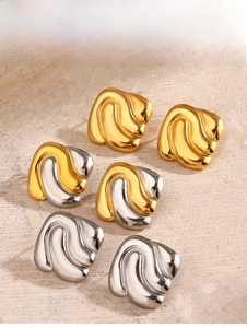 Detailed view of square wavy earrings in gold, silver and mixed tones with a mirror finish
