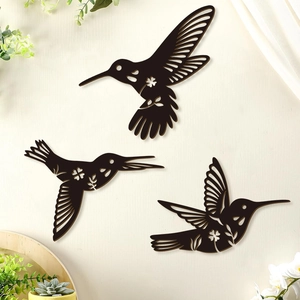 Set of 3 black wooden hummingbird wall art pieces with floral cutout designs