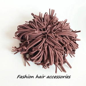 Detail of coffee brown high-elasticity hair ties bundle with fashion accessories label
