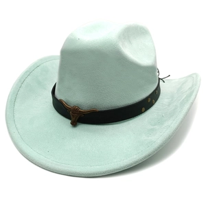 Detail of mint green suede cowboy hat with vintage bronze bull head and leather band